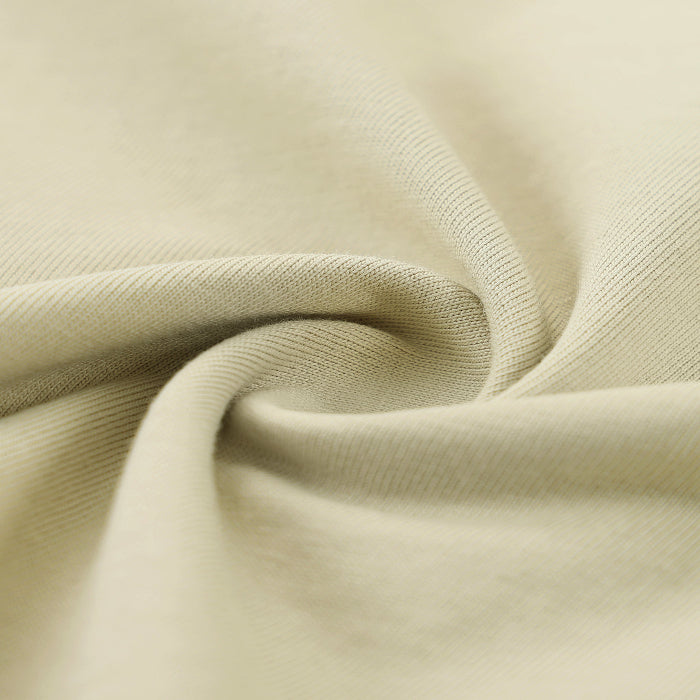 Close-up of beige fabric with folds