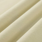 Close-up of beige fabric with a ribbed texture