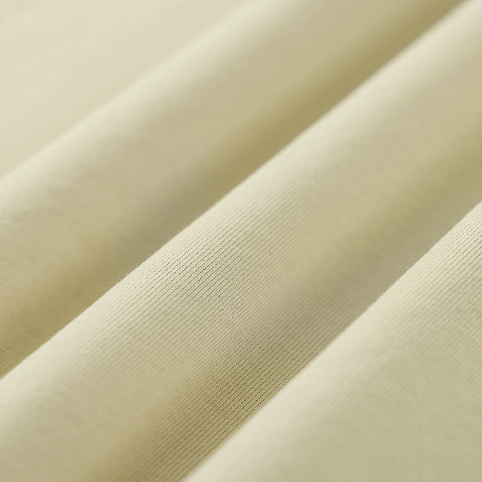 Close-up of beige fabric with a ribbed texture